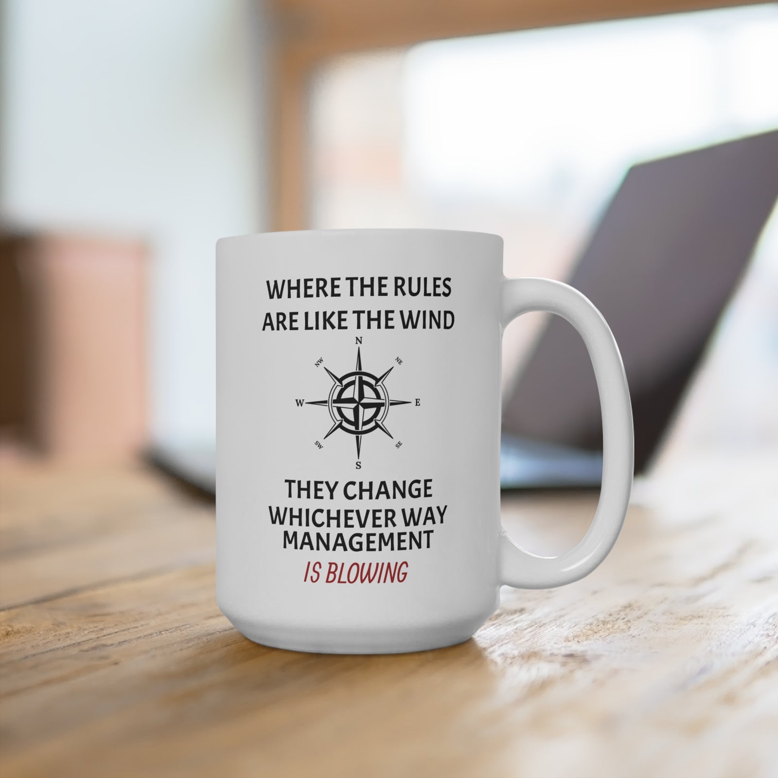 Mug with humor regarding the way management changes the rules like the wind.
